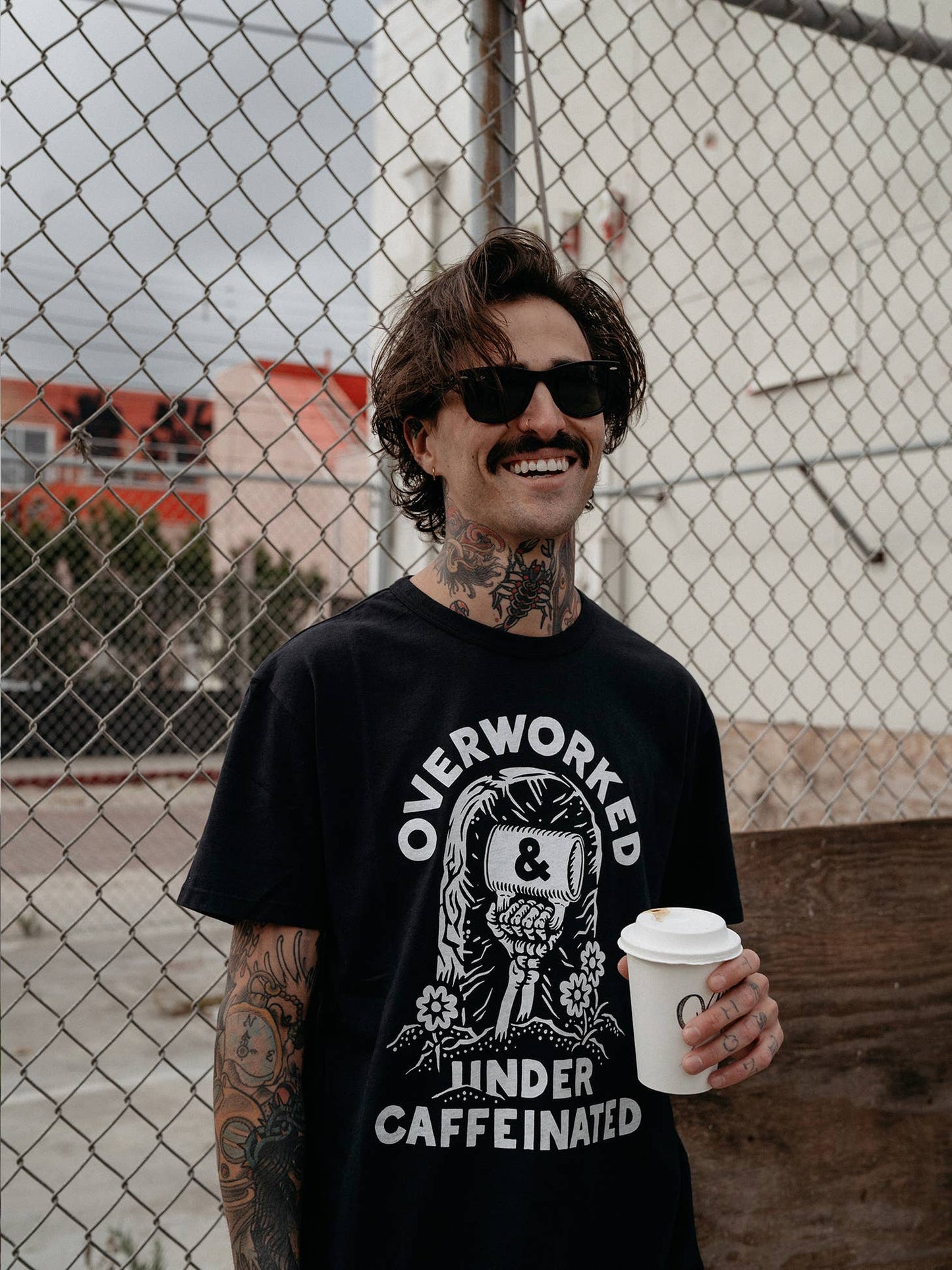 Pyknic Over Worked Under Caffeinated T-Shirt featuring bold text print, casual fit, perfect for coffee lovers and daily wear.