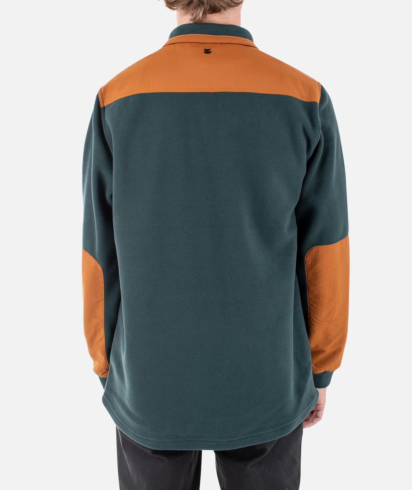 Jetty Pines fleece jacket in tidal color, showing a cozy, lightweight fleece jacket with a zip-up front and high collar.