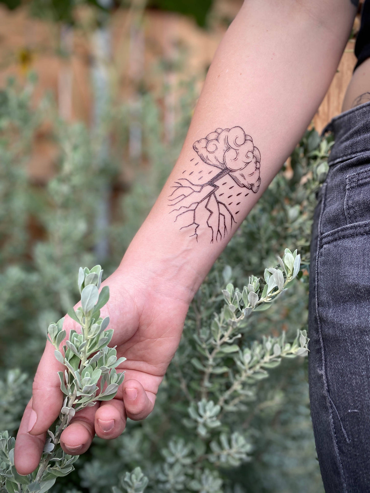 Storm Cloud temporary tattoo by NatureTats featuring a realistic, detailed storm cloud design on skin.