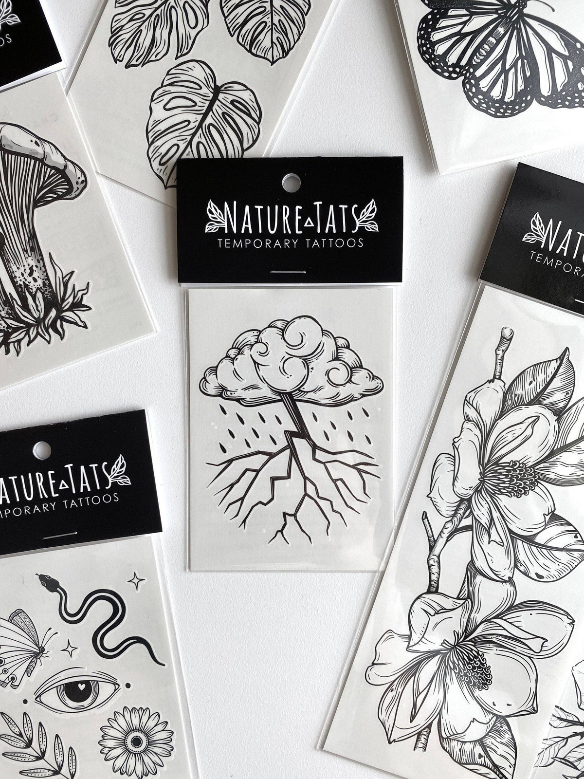 Storm Cloud temporary tattoo by NatureTats featuring a realistic cloudy storm design on skin.