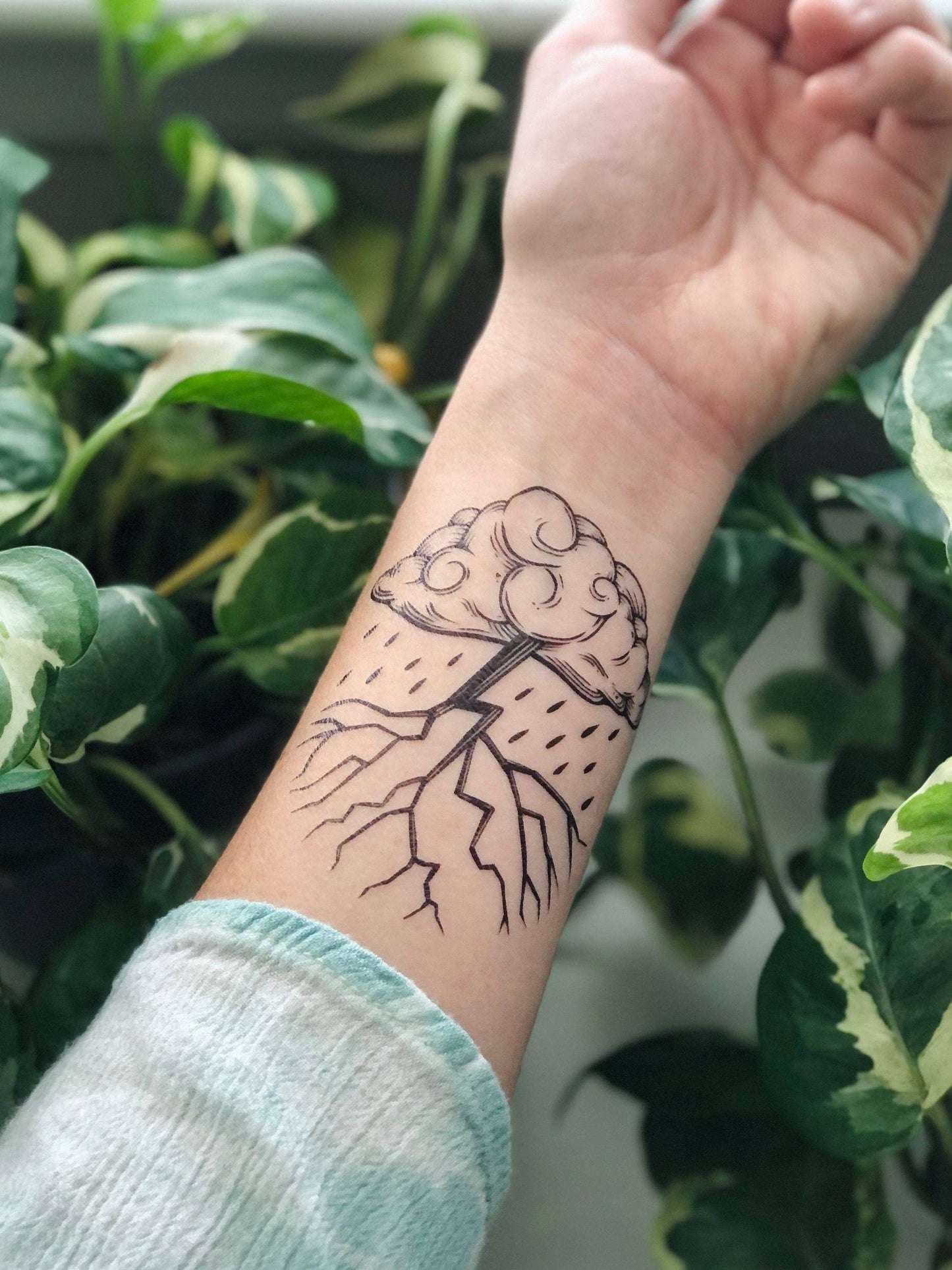 NatureTats Storm Cloud temporary tattoo featuring a detailed storm cloud design on skin.